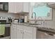 Modern kitchen with stainless steel appliances and granite countertops at 4291 Lamar St, Decatur, GA 30035