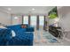 Bright living room with a large sectional sofa and tile floors at 4291 Lamar St, Decatur, GA 30035