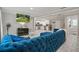 Open floor plan with blue sectional sofa and kitchen view at 4291 Lamar St, Decatur, GA 30035