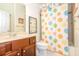 bathroom with colorful shower curtain and vanity at 101 Chestnut Dr, Canton, GA 30114