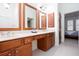 Spacious bathroom with dual vanities and a large mirror and dark wood cabinets at 101 Chestnut Dr, Canton, GA 30114