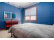 Chic bedroom with eye-catching wallpaper, gray comforter, and vibrant red accents, offering a lively space at 101 Chestnut Dr, Canton, GA 30114