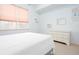 Calm bedroom featuring neutral colors, a dresser, and two windows at 101 Chestnut Dr, Canton, GA 30114