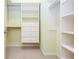 Custom closet featuring multiple shelves, drawers, and hanging rods for storage at 101 Chestnut Dr, Canton, GA 30114