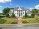 Exterior of clubhouse with landscaped grounds on a sunny day at 101 Chestnut Dr, Canton, GA 30114