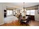 Open concept dining room features hardwood floors and a view into the living room with fireplace at 101 Chestnut Dr, Canton, GA 30114
