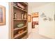 Hallway featuring built-in shelves and entry to a home theater at 101 Chestnut Dr, Canton, GA 30114