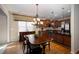 Charming eat-in kitchen features wood floors, chandelier, and stainless steel appliances at 101 Chestnut Dr, Canton, GA 30114