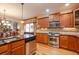 Well-lit kitchen boasts granite countertops, stainless steel appliances, and breakfast bar seating at 101 Chestnut Dr, Canton, GA 30114