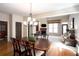 Dining room view of the living room with a fireplace and light-filled windows at 101 Chestnut Dr, Canton, GA 30114