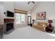 Cozy living room featuring a fireplace, carpet, and access to the porch at 101 Chestnut Dr, Canton, GA 30114