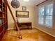 Cozy home office featuring hardwood floors, built-in bookshelves, and plantation shutters at 101 Chestnut Dr, Canton, GA 30114