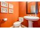 Stylish powder room with pedestal sink and decorative wall art at 101 Chestnut Dr, Canton, GA 30114