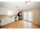 Kitchen with white cabinets, stainless steel appliances, and hardwood floors at 3121 Jessica Dr, Douglasville, GA 30135