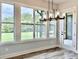 Breakfast nook with wood-look floors, large windows, and a chandelier at 115 Palisade Dr, Rydal, GA 30171