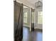 Dark stained wood sliding barn doors in the entryway at 115 Palisade Dr, Rydal, GA 30171