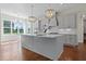 Kitchen island with white quartz countertops and gray cabinets at 115 Palisade Dr, Rydal, GA 30171