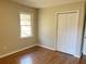 This bedroom features hardwood floors, a window for natural light, and a closet for storage at 1820 Arkose Dr, Atlanta, GA 30316