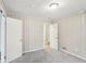 A bedroom featuring carpet, vertical wood-look accents, and 2 access doors at 1820 Arkose Dr, Atlanta, GA 30316