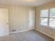 Bedroom features carpeting, a window, and a closet, creating a cozy and functional living space at 1820 Arkose Dr, Atlanta, GA 30316