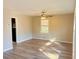 Cozy bedroom with carpeting, paneled walls and a window overlooking the backyard at 1820 Arkose Dr, Atlanta, GA 30316