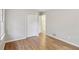 A bright bedroom features hardwood floors and a double door closet at 1820 Arkose Dr, Atlanta, GA 30316