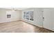 Bright living room featuring new vinyl floors, neutral paint, a ceiling fan and natural light from a window at 1820 Arkose Dr, Atlanta, GA 30316