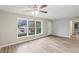 Living room with hardwood floors, large windows, and ceiling fan at 1820 Arkose Dr, Atlanta, GA 30316