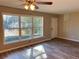 Bright living area with sleek flooring, ceiling fan, and large windows at 1820 Arkose Dr, Atlanta, GA 30316