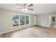 Open living room featuring neutral walls, ceiling fan, and new stylish flooring at 1820 Arkose Dr, Atlanta, GA 30316