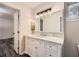 Modern bathroom featuring a white vanity with marble countertop and a large mirror at 2536 Nw Ridgecrest Nw Dr, Kennesaw, GA 30152