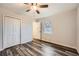 Bright bedroom with wood-look flooring and a double-door closet at 2536 Nw Ridgecrest Nw Dr, Kennesaw, GA 30152