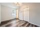 Charming bedroom featuring neutral walls, wood-look flooring and a double door closet at 2536 Nw Ridgecrest Nw Dr, Kennesaw, GA 30152