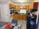 Galley kitchen with wood cabinets and dark countertops at 3882 Parklane Dr, Clarkston, GA 30021