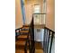 Wooden staircase with black railing leading upstairs at 3882 Parklane Dr, Clarkston, GA 30021