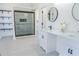 Modern bathroom with double vanity and walk-in shower at 5055 Promenade Sw Dr, Atlanta, GA 30331