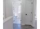 View from landing to a neutral bathroom with tiled floor at 5055 Promenade Sw Dr, Atlanta, GA 30331