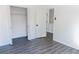 Bright bedroom with grey wood flooring and spacious closet at 5055 Promenade Sw Dr, Atlanta, GA 30331