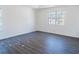 Spacious bedroom features hardwood floors, natural light and neutral paint at 5055 Promenade Sw Dr, Atlanta, GA 30331