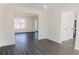 Open concept dining room with gray vinyl plank flooring at 5055 Promenade Sw Dr, Atlanta, GA 30331