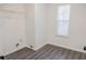 Laundry room with grey flooring and shelving for storage at 5055 Promenade Sw Dr, Atlanta, GA 30331