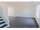 Spacious living room featuring gray vinyl plank flooring at 5055 Promenade Sw Dr, Atlanta, GA 30331