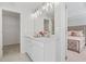 Double vanity bathroom with white cabinets and a walk-in closet at 86 Trailview Ln, Hiram, GA 30141