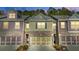 Evening view of townhome with landscaping and garage at 86 Trailview Ln, Hiram, GA 30141