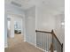 Upstairs hallway with carpeted floor and access to bedrooms at 86 Trailview Ln, Hiram, GA 30141