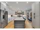 Spacious kitchen featuring stainless steel appliances and hardwood floors at 1300 Bridgewater Walk, Snellville, GA 30078