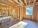 Image of a bedroom under construction, with a window and basic framing at 2486 Jefferson Ter, Atlanta, GA 30344