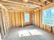 Image shows a bedroom in framing stage with two windows at 2486 Jefferson Ter, Atlanta, GA 30344