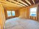 Image of a bedroom in framing stage, featuring two windows at 2486 Jefferson Ter, Atlanta, GA 30344
