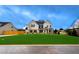 Two story house with a green lawn and a wooden fence at 1401 Stephens View Dr, Loganville, GA 30052